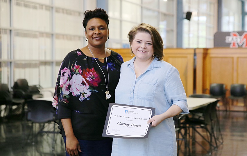 East Mississippi Community College Division of Nursing and Allied Health Director Dr. Tonsha Emerson, at left, presents Associate Degree Nursing student Lindsay Hatch with a certificate in recognition of her selection as a recipient of a 2019 Mississippi Nurses Foundation School of Nursing Scholarship. East Mississippi Community College Division of Nursing and Allied Health Director Dr. Tonsha Emerson, at left, presents Associate Degree Nursing student Lindsay Hatch with a certificate in recognition of her selection as a recipient of a 2019 Mississippi Nurses Foundation School of Nursing Scholarship.