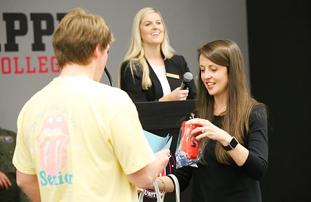Columbus-Lowndes Chamber of Commerce Education Committee member Alison Alexander, at right, who is also an instructor at East Mississippi Community College, passes out door prizes at the chamber's "Senior Sendoff" event at the college. Columbus-Lowndes Chamber of Commerce Education Committee member Alison Alexander, at right, who is also an instructor at East Mississippi Community College, passes out door prizes at the chamber's "Senior Sendoff" event at the college.